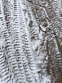 car trail on snowy ground