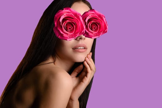 Abstract contemporary art collage portrait of young woman with red rose flowers on face hides her eyes on pink background