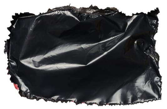 Torn piece of black polyethylene on isolated background, close up