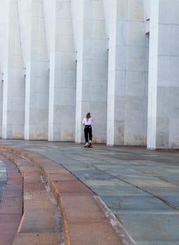 Close up shot of the teenage girl skating outdoors.