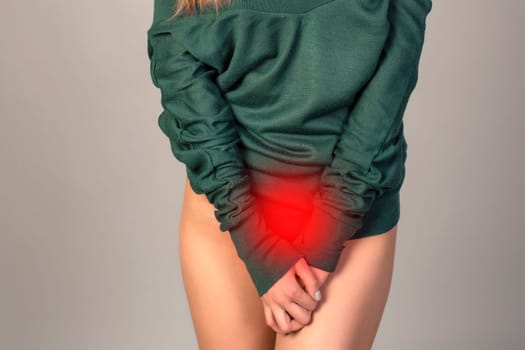 Menstrual pain, woman with stomachache suffering from pms , endometriosis, cystitis and other diseases of the urinary system, painful area highlighted in red