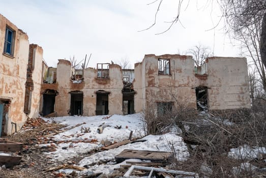 Post-war landscape. Destroyed building. War ruins. Destroyed city after the bombing. Dead city. Bombed buildings. Debris buildings. War destruction.