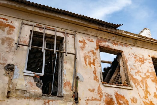 Post-war landscape. Destroyed building. War ruins. Destroyed city after the bombing. Dead city. Bombed buildings. Debris buildings. War destruction.