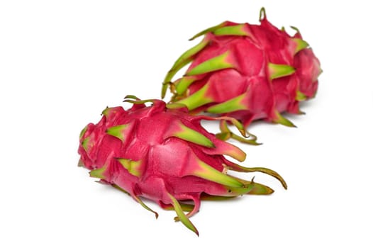One whole dragon fruit isolated on white background, full depth of field