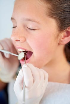 Dental, exam and girl and dentist with mirror zoom for tooth cavity or gum disease search. Oral care, tool or kid consulting specialist for teeth whitening, growth or bacteria, braces or development.