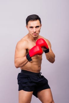 Training, young man and boxer with boxing gloves for a competition, prepare for match