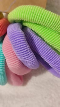 bright multi-colored fabric hair ties, women's accessories, objects. High quality photo