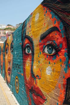 A vibrant mural painting on an urban wall, celebrating art and community expression.