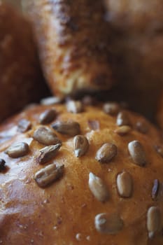 detail shot of sunflower seed baked bread on table .