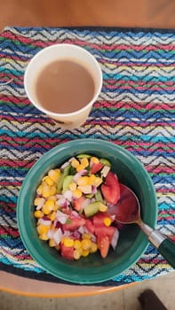 fresh vegetable salad and glass of coffee, breakfast food. High quality photo