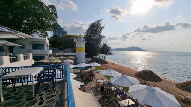 Bangsaray Pattaya Thailand 28 February 2024, Relaxing day at the beach with colorful umbrellas and chairs dotting the sandy shoreline, inviting visitors to unwind and enjoy the ocean view.