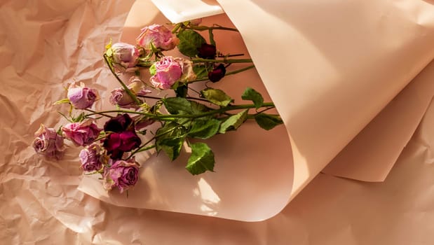 Concept shot of the background theme, wrapping paper, dried roses other flowers and other arrangements.