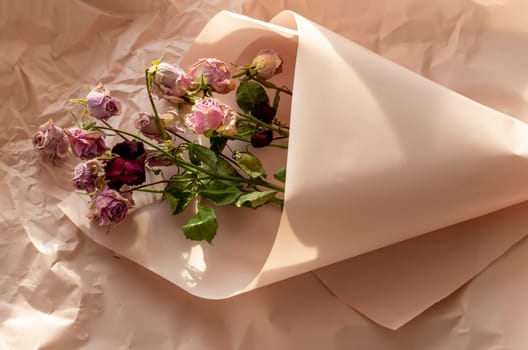 Concept shot of the background theme, wrapping paper, dried roses other flowers and other arrangements