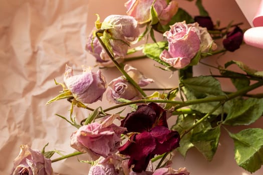 Concept shot of the background theme, wrapping paper, dried roses other flowers and other arrangements