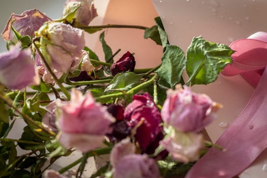 Concept shot of the background theme, wrapping paper, dried roses other flowers and other arrangements