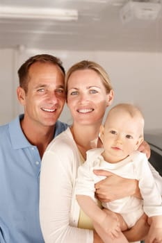 Couple, baby and portrait with home, family love and smile or happiness for domestic. Father, mother and kid in house, garage and car for travel with parenting relationship and childhood bonding.