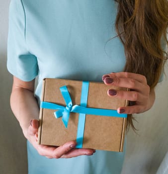 Close up shot of the woman holding rapped gift box
