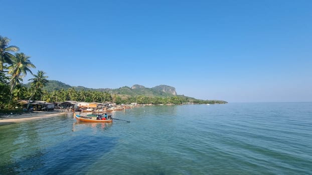 Koh Mook Thailand 20 January 2024 Two boats peacefully float on the tranquil surface of the water.