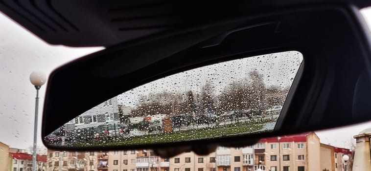 Concept shot of the car window covered by rain drops