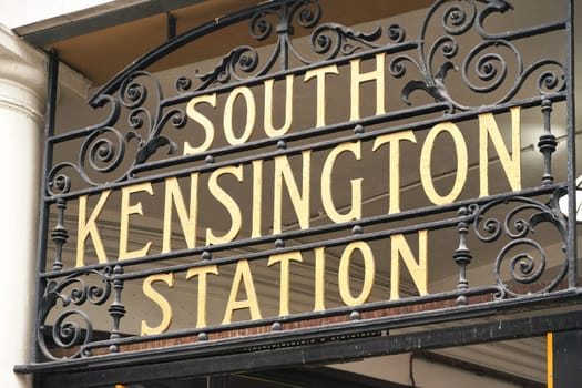 South Kensington station sign at the entrance to London underground station