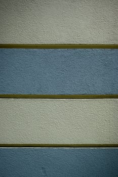 texture of a building wall painted with stripes as a background 1