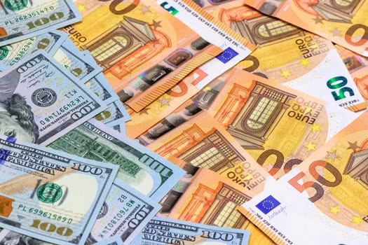 Banknotes of 100 dollars and 50 euros 2