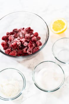 With measured ingredients carefully placed on the counter, the preparation for a delectable Raspberry Cake Filling begins, promising a delightful fruity addition to any dessert.