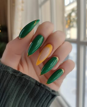 Female hand with long nails and bright green manicure with bottles of nail polish. High quality photo