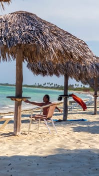 03.03.2024 - Cayo Coco Island, Cuba - Beach of the Brisas hotel. Guest is practicing breathing technique