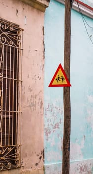Concept shot of the street of an old city. Children road sign