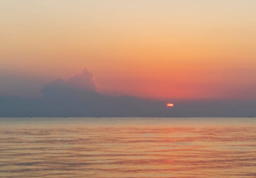Shot of the dramatic sunrise by the sea.