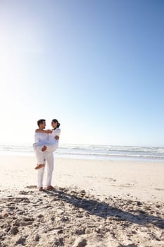 Couple, husband, wife and honeymoon on island and happy for getaway, travel and vacation in Bali. Man and woman and love for celebration, union and companionship at beach or seaside in Indonesia.