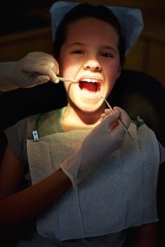 Dental mirror, hands or girl face with dentist for mouth exam, tooth cavity or gum disease, bacteria or search. Oral, wellness or doctor with light, equipment or pediatric dentistry tool or cleaning.
