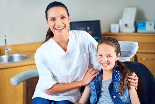 Portrait, girl and dentist with kid, checkup and appointment for medical procedure and oral care. Face, professional and child with employee and dental health with hygiene and trust with consultation.