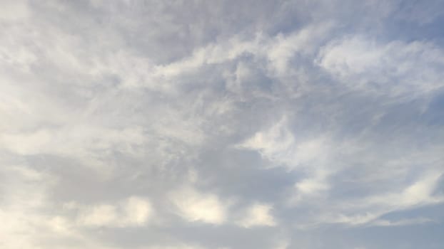 Blue gray light sky nature white clouds whether background, sun face . High quality photo