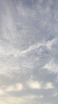 Blue gray light sky nature white clouds whether background, sun face . High quality photo
