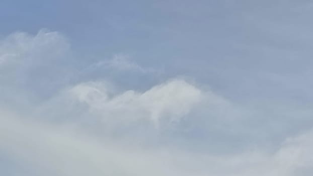 Blue gray light sky nature white clouds whether background, sun face . High quality photo