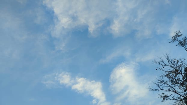 Blue gray light sky nature white clouds whether background, sun face . High quality photo