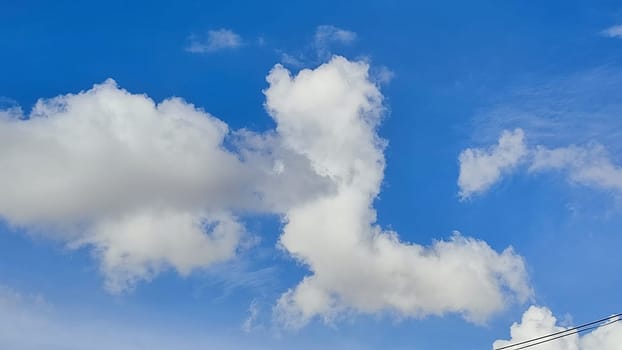 Blue gray light sky nature white clouds whether background, sun face . High quality photo