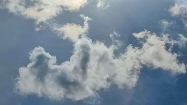 Blue gray light sky nature white clouds whether background, sun face . High quality photo