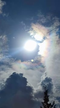 Blue gray light sky nature white clouds whether background, sun face . High quality photo
