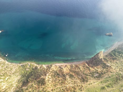 Blue sky with white clouds over calm summer panorama of the sea. Drone aerial view. Abstract aerial nature summer ocean sunset sea and sky background. Horizon. No people. Holiday and vacation concept