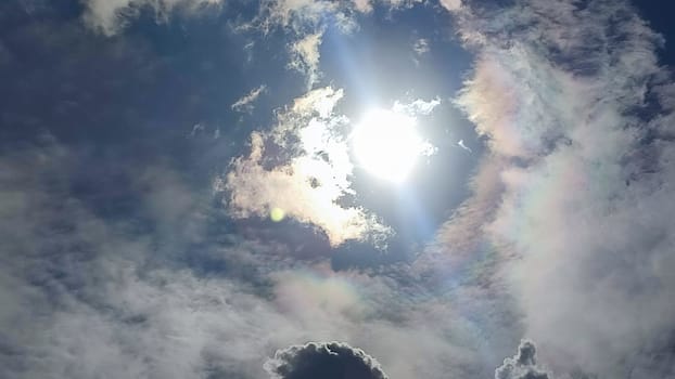 Blue gray light sky nature white clouds whether background, sun face . High quality photo