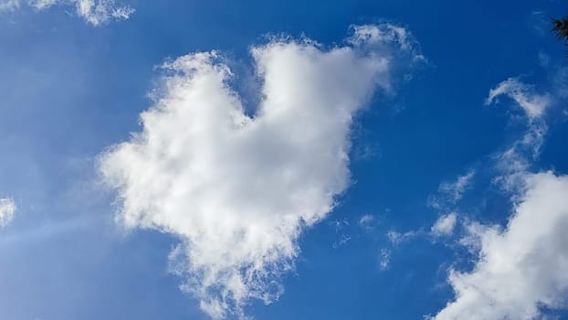 Blue gray light sky nature white clouds whether background, sun face . High quality photo