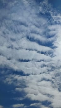 Blue gray light sky nature white clouds whether background, sun face . High quality photo