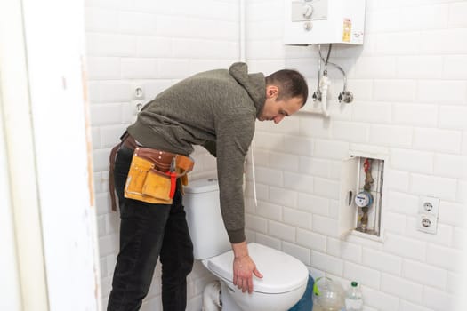 Plumber repairing a toilet cistern. High quality photo