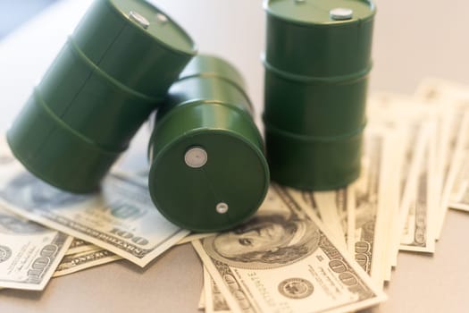 a barrel and dollar bills on a white background. High quality photo