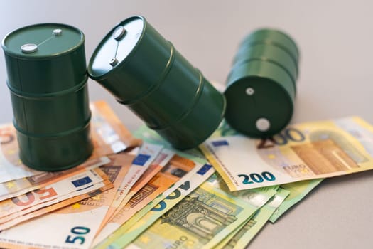 oil barrel with money, euro banknotes closeup. High quality photo