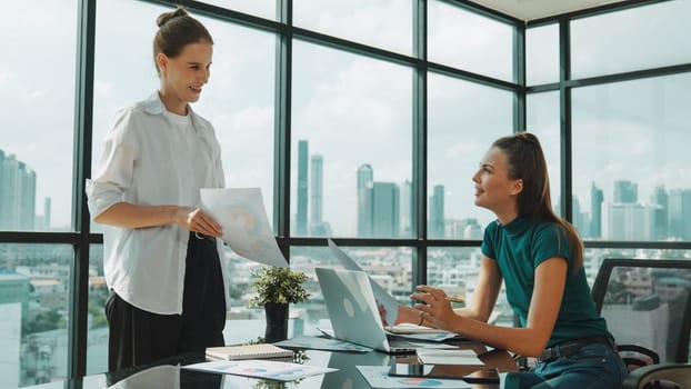 Smart businesswoman present start up project while executive manager listen carefully. Professional business team working together, sharing, discussing, thinking about business idea. Tracery