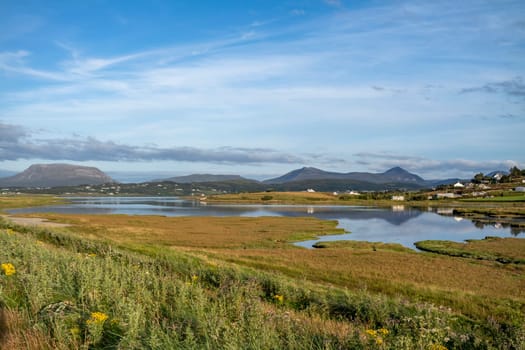 MAGHEROARTY, IRELAND - JULY 31 2022: Holiday makers enjoying the are.